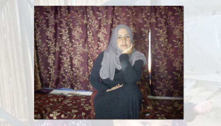 ختام أمٌّ لأربعة أولاد وتربي طفلاً سورياً يتيماً