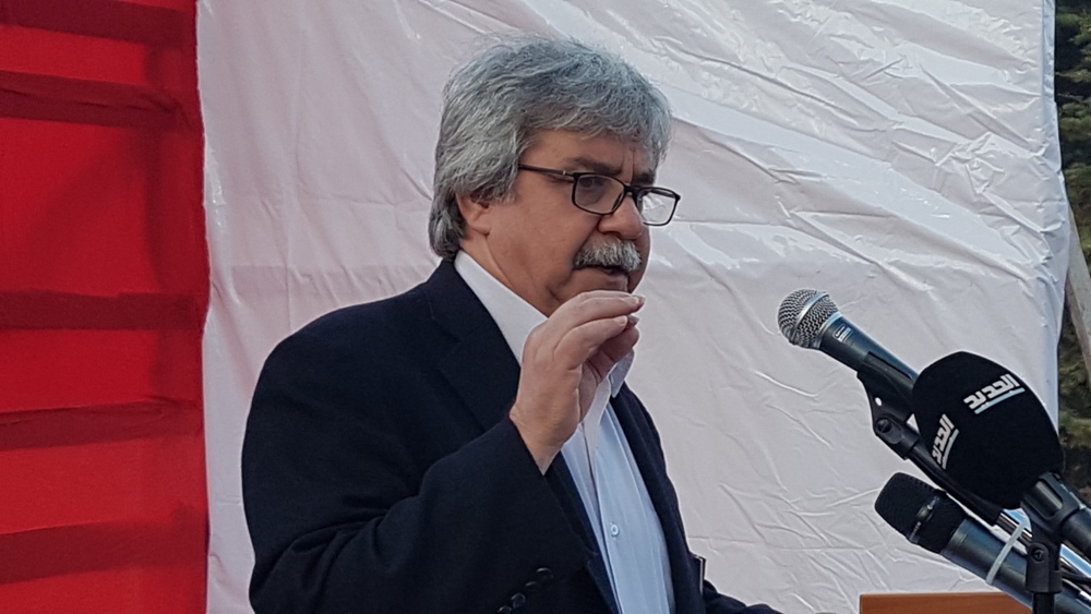 حنا غريب متحدثا في احتفال حولا