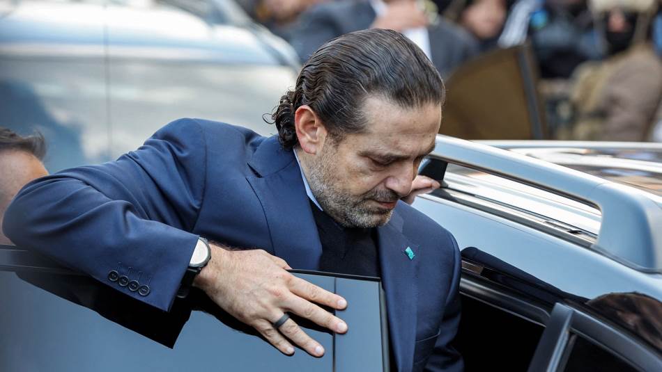 نظرات الحريري التائهة كمن يبحث، مثلهم، عن خلاص متعذّر (Getty)